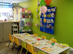 Birthday party table, with a arts and crafts and balloons